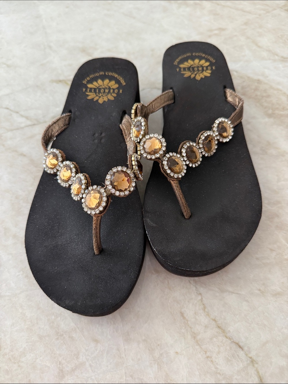 Yellow Box Black Thong Sandals with Gold Gem Embellishments